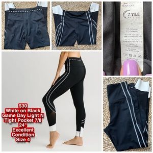 EUC ZYIA White on Black Game Dat Light N Tight Pocket 7/8 24"